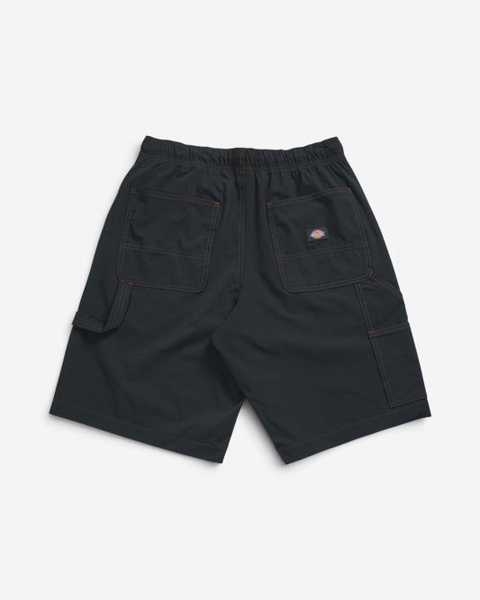 Чорні чоловічі шорти Dickies у робочому стилі, вигляд ззаду, з великими кишенями, петлею для інструментів, еластичним поясом та помаранчевою ниткою швів.