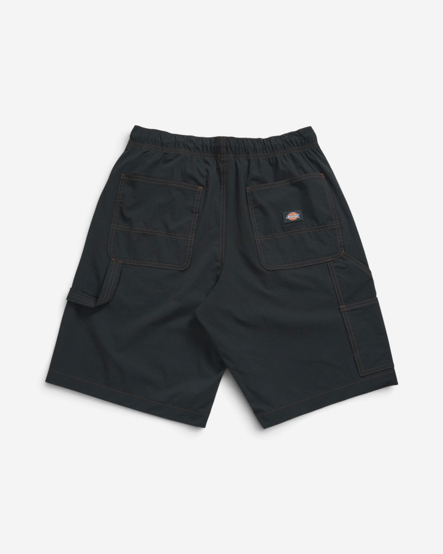 Чорні чоловічі шорти Dickies у робочому стилі, вигляд ззаду, з великими кишенями, петлею для інструментів, еластичним поясом та помаранчевою ниткою швів.