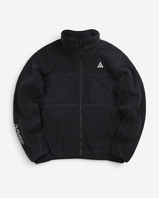 Чорна флісова куртка Nike ACG Arctic Wolf Full-Zip Fleece Jacket з високим коміром, нагрудними кишенями та білим трикутним логотипом на грудях.