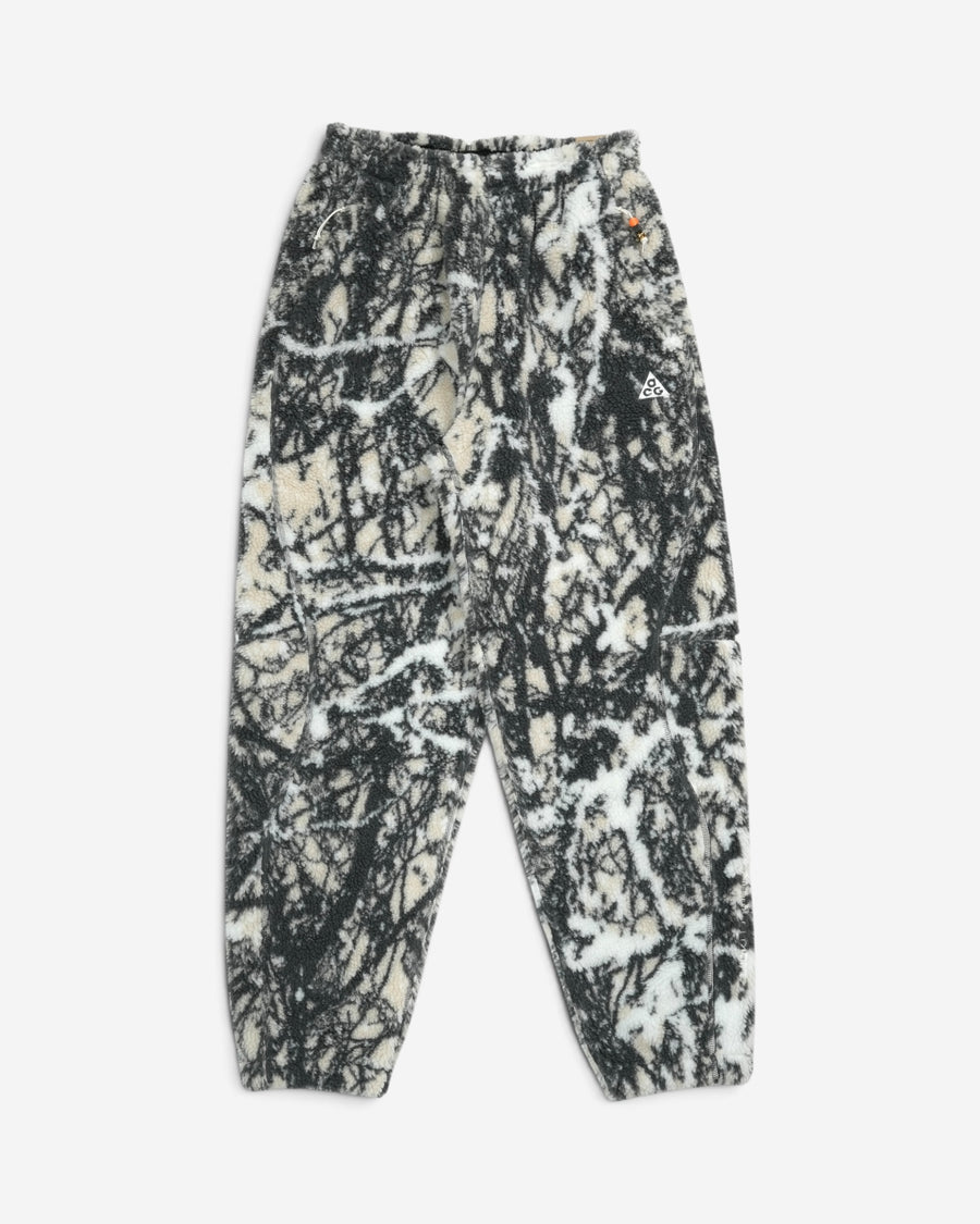 Флісові вільні штани Nike ACG Canwell Glacier з контрастним чорно-білим гірським принтом, еластичним поясом та вишитим білим логотипом на стегні.