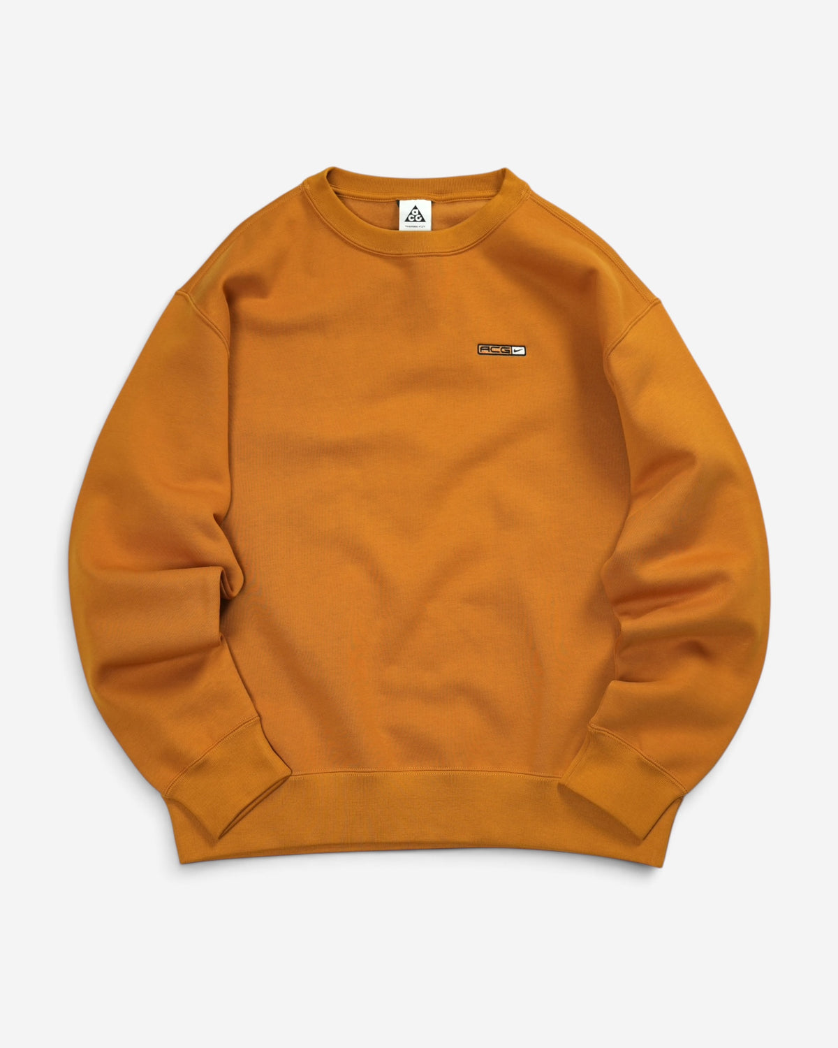 Гірчично-жовтий світшот Nike ACG Tuff Fleece Crew з круглою горловиною, еластичними манжетами та горизонтальним логотипом ACG на грудях.