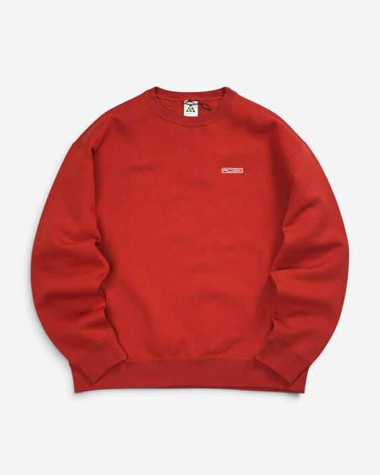 Теракотово-рудий світшот Nike ACG Tuff Fleece Crew з круглим вирізом, щільними манжетами та невеликим прямокутним логотипом ACG на грудях.