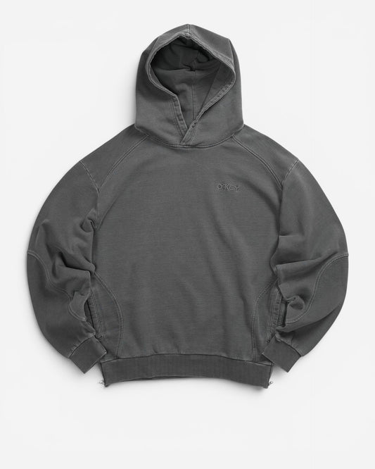 Худі Oakley Indigo Side Zip Hoodie сірого кольору Bleached Grey. Вільний крій оверсайз, 100% бавовна, ефект вицвітання, бічні блискавки. В AND GARMENT.