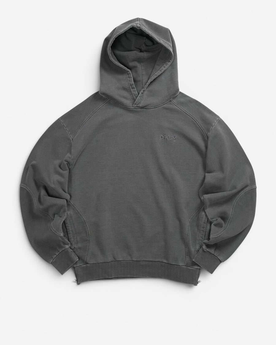 Худі Oakley Indigo Side Zip Hoodie сірого кольору Bleached Grey. Вільний крій оверсайз, 100% бавовна, ефект вицвітання, бічні блискавки. В AND GARMENT.